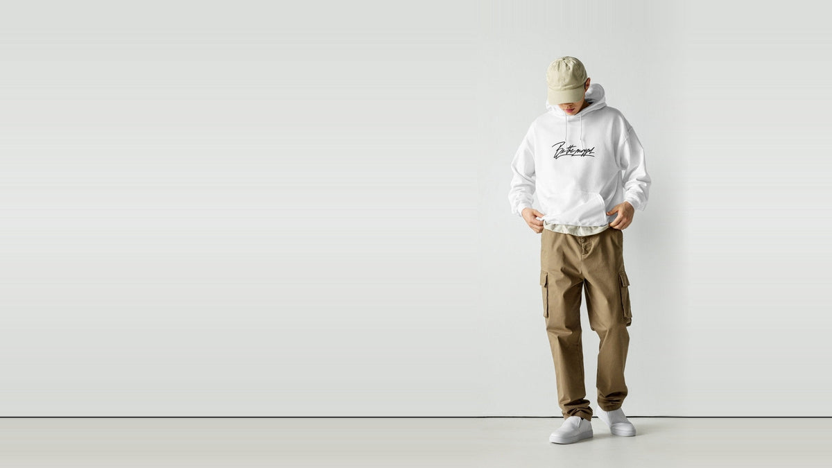 Model in the white Be The Mogger hoodie