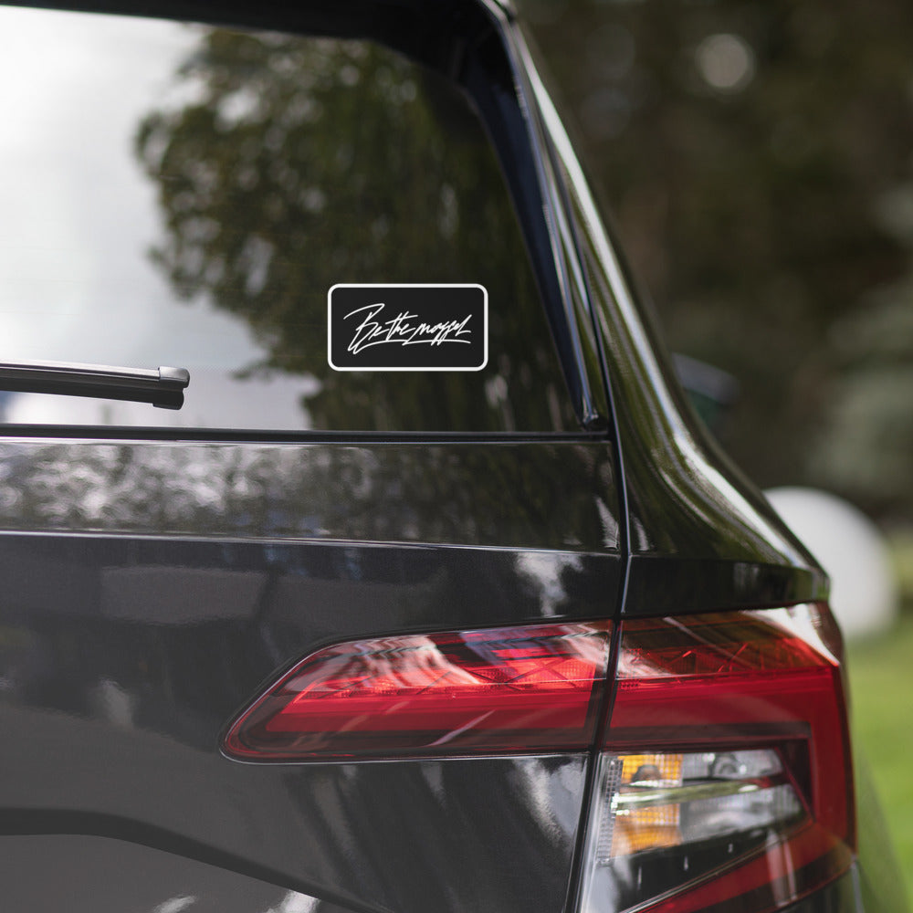 Be The Mogger sticker on a car window
